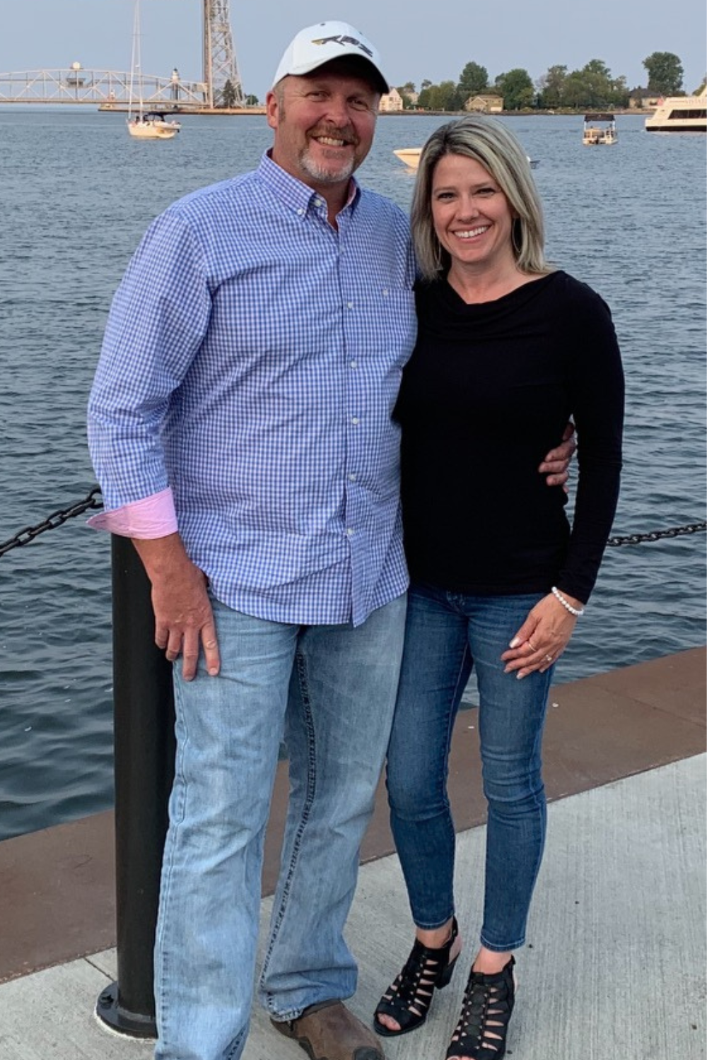 Jenni and Justin, passionate hosts against the scenic beauty of Lake Superior.