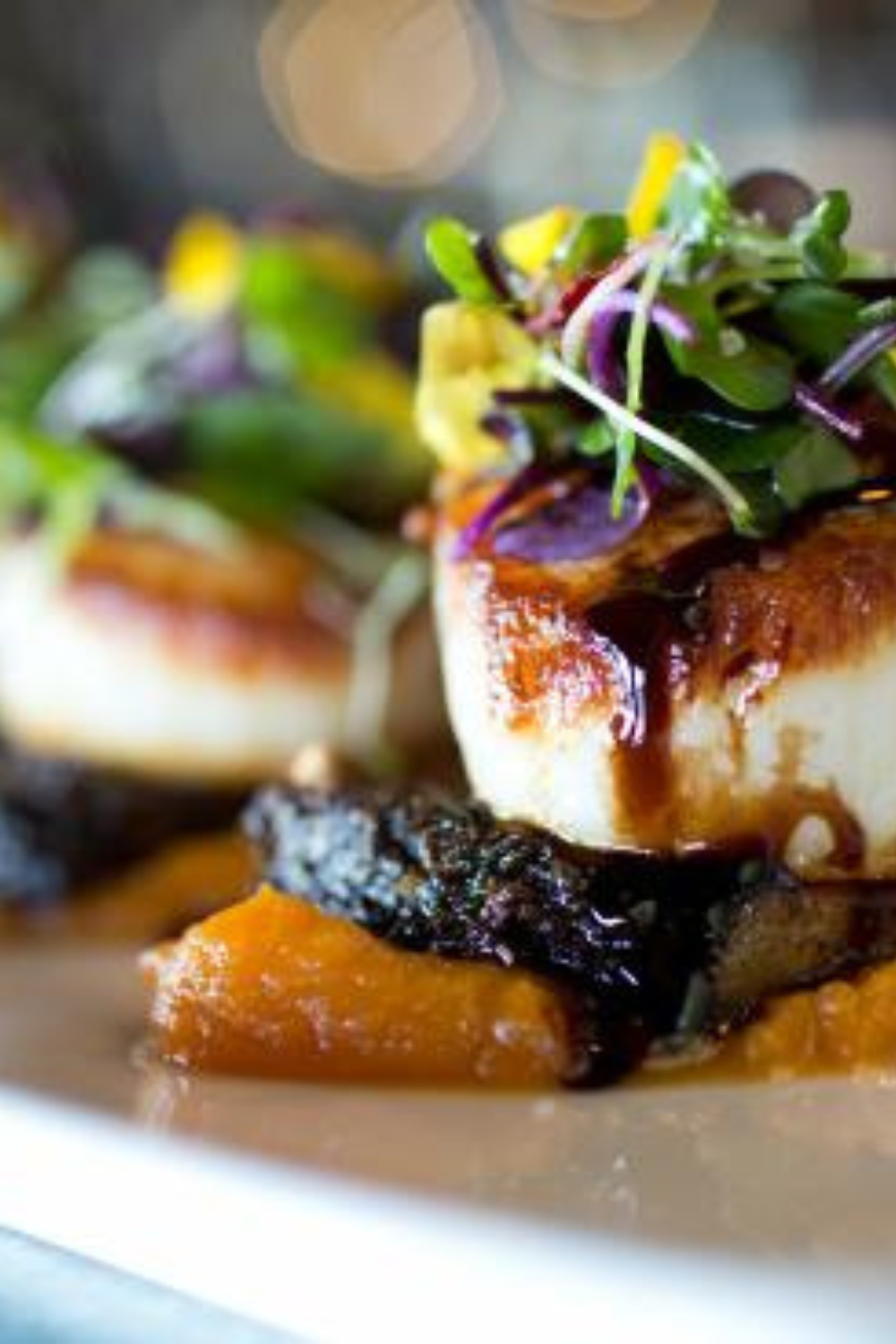 A rustic dining setup overlooking Lake Superior, with a spread of local dishes celebrating the region's culinary heritage.